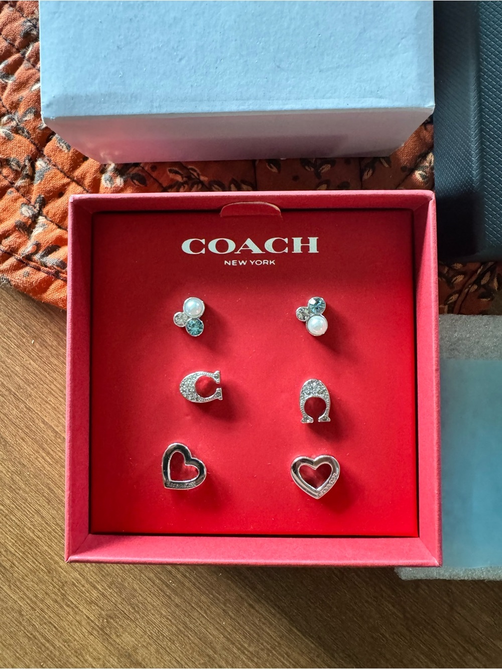 Coach Silver Tone Three-Pair Stud Earring Set with Pearl and Heart Motifs